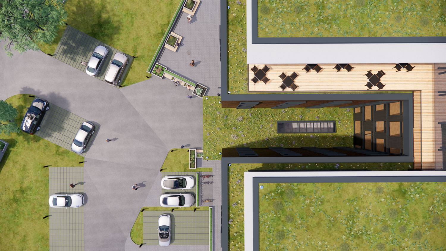 Luftaufnahme eines modernen Gebaeudes mit Gruendach Parkplaetzen und Autos
