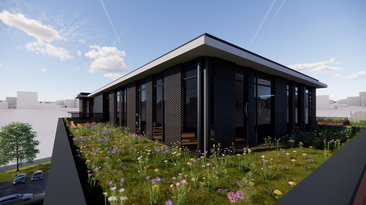 Modernes Gebaeude mit dunkler Fassade und bluehendem Dachgarten bei Sonne